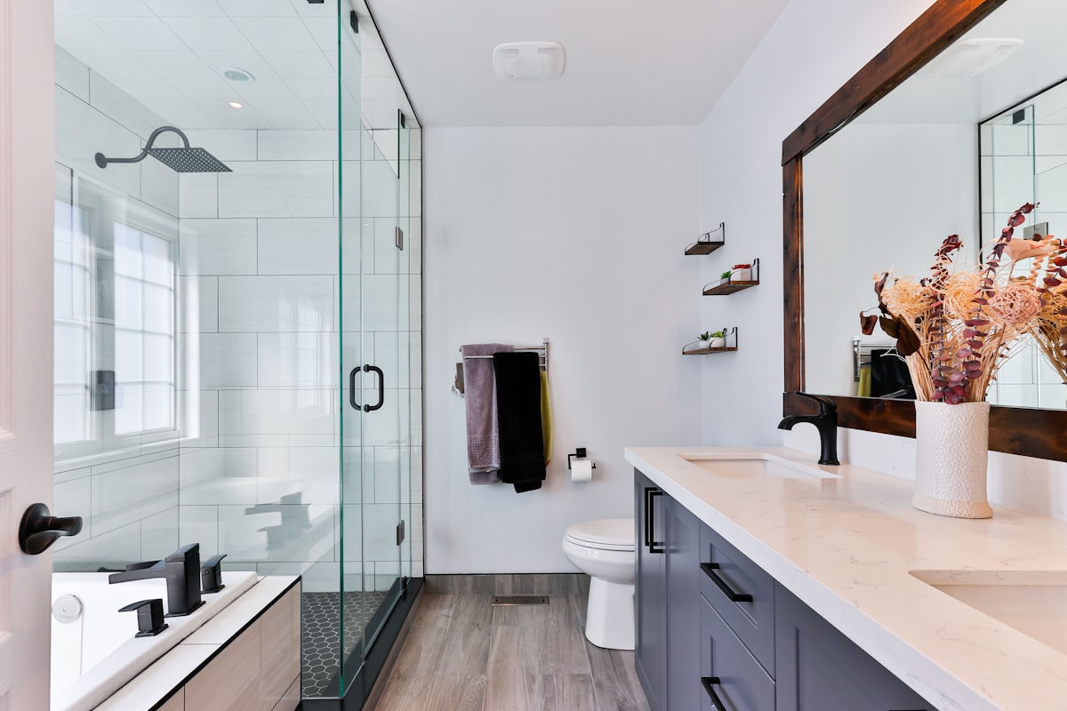 A clean, modern bathroom kept running by Your Neighbors Plumber